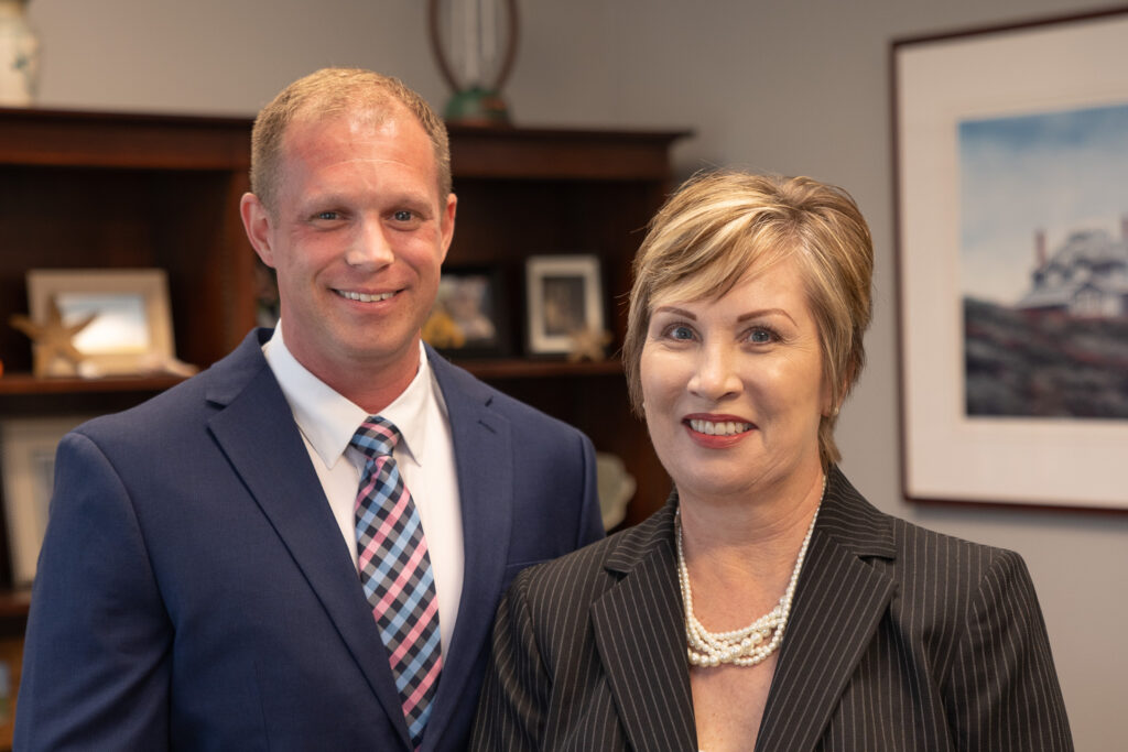 CAO Holt and CEO Owen smile for a headshot together