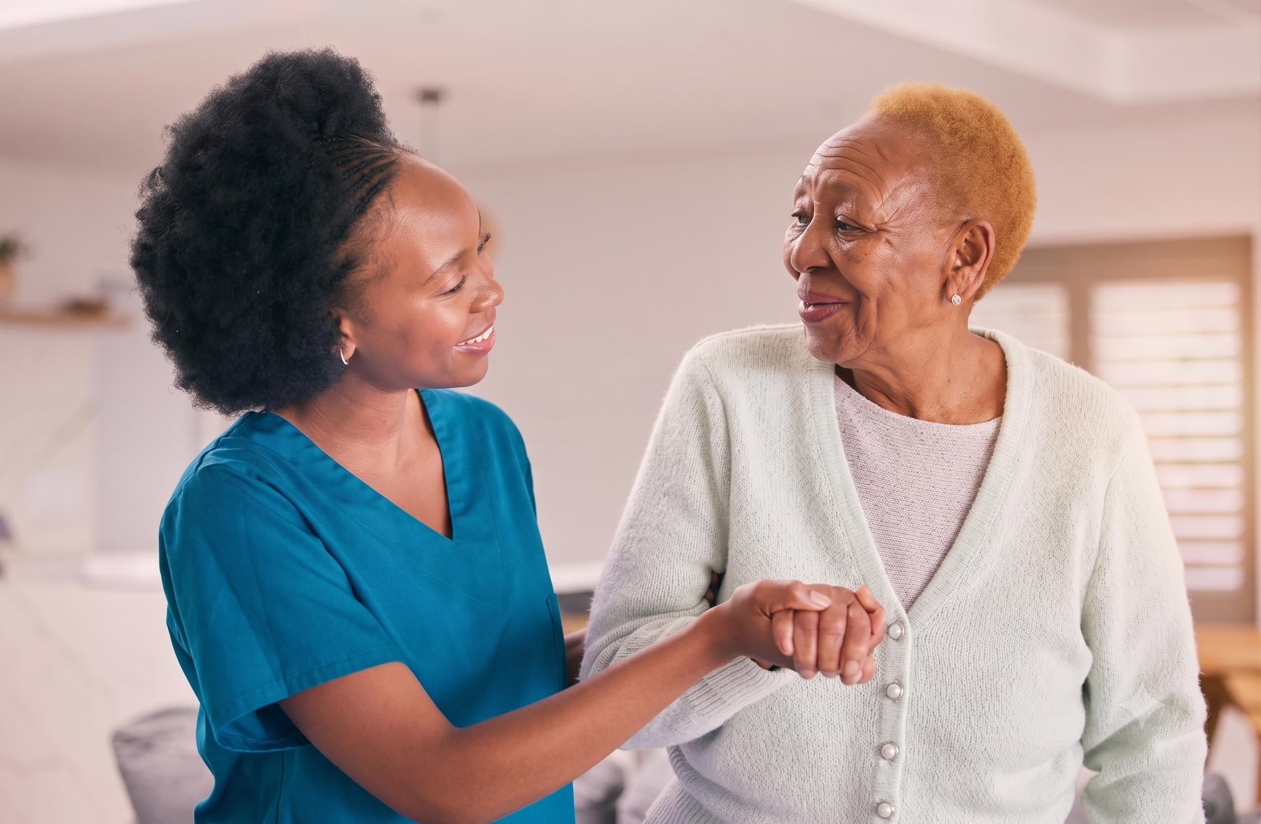 nurse helping elderly woman walk